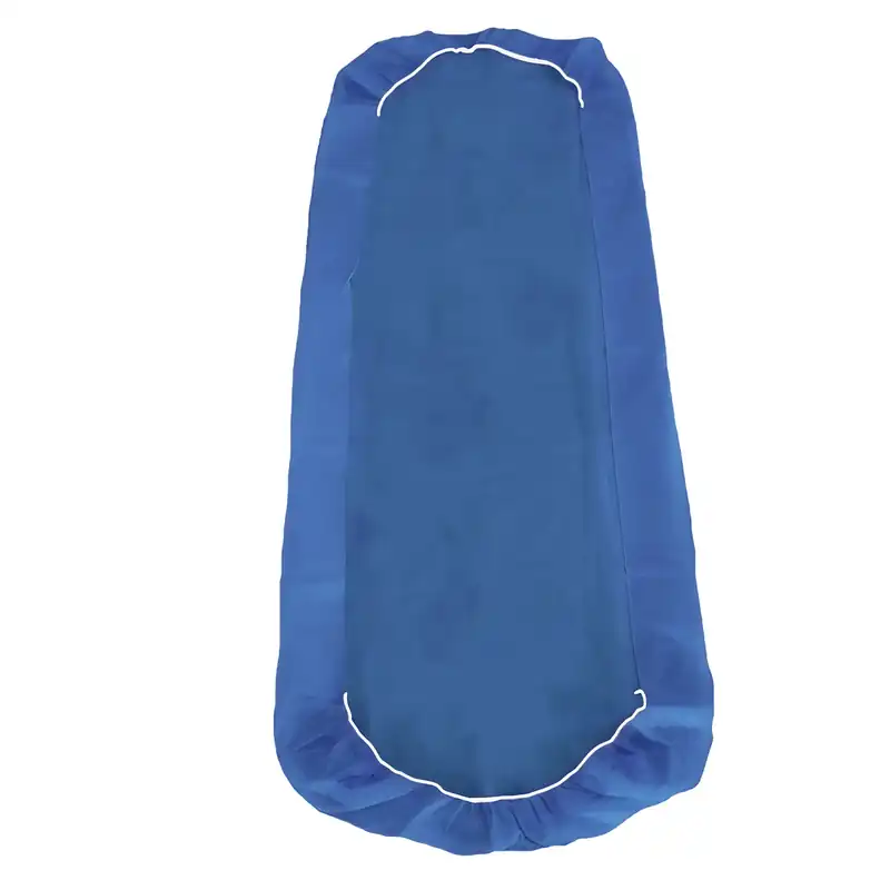 Blue fitted disposable sheet for a massage table